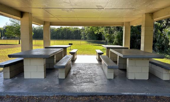 Picnic tables under a covered pavilion