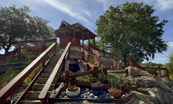 One hole at Anastasia Mini Golf starts at the top of a stone mountain