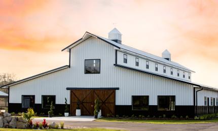 The Grand Cypress Barn at Ancient City Farmstead during sunset