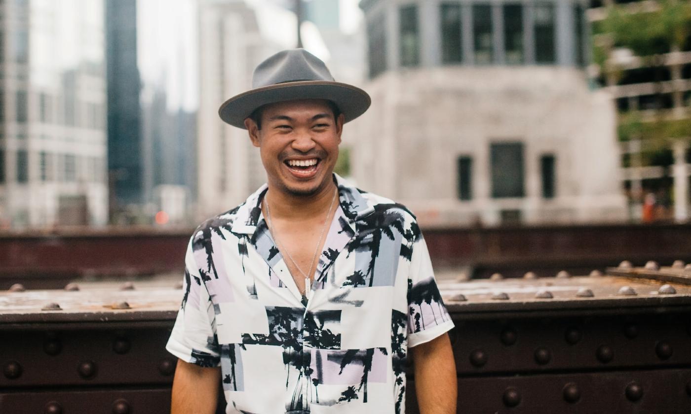 Andrew Sapin, musician, standing on a roof in Jacksonville