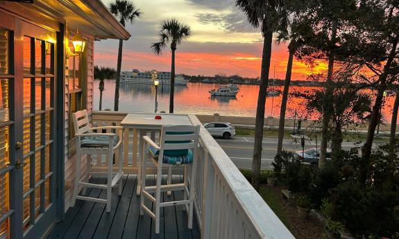 One guest room at this bed and breakfast features a deck that overlooks the bayfront in St. Augustine, here lit by sunrise