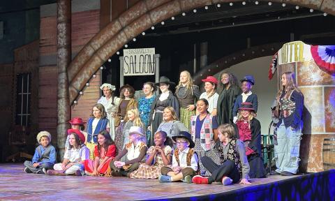 A group of children performing on stage