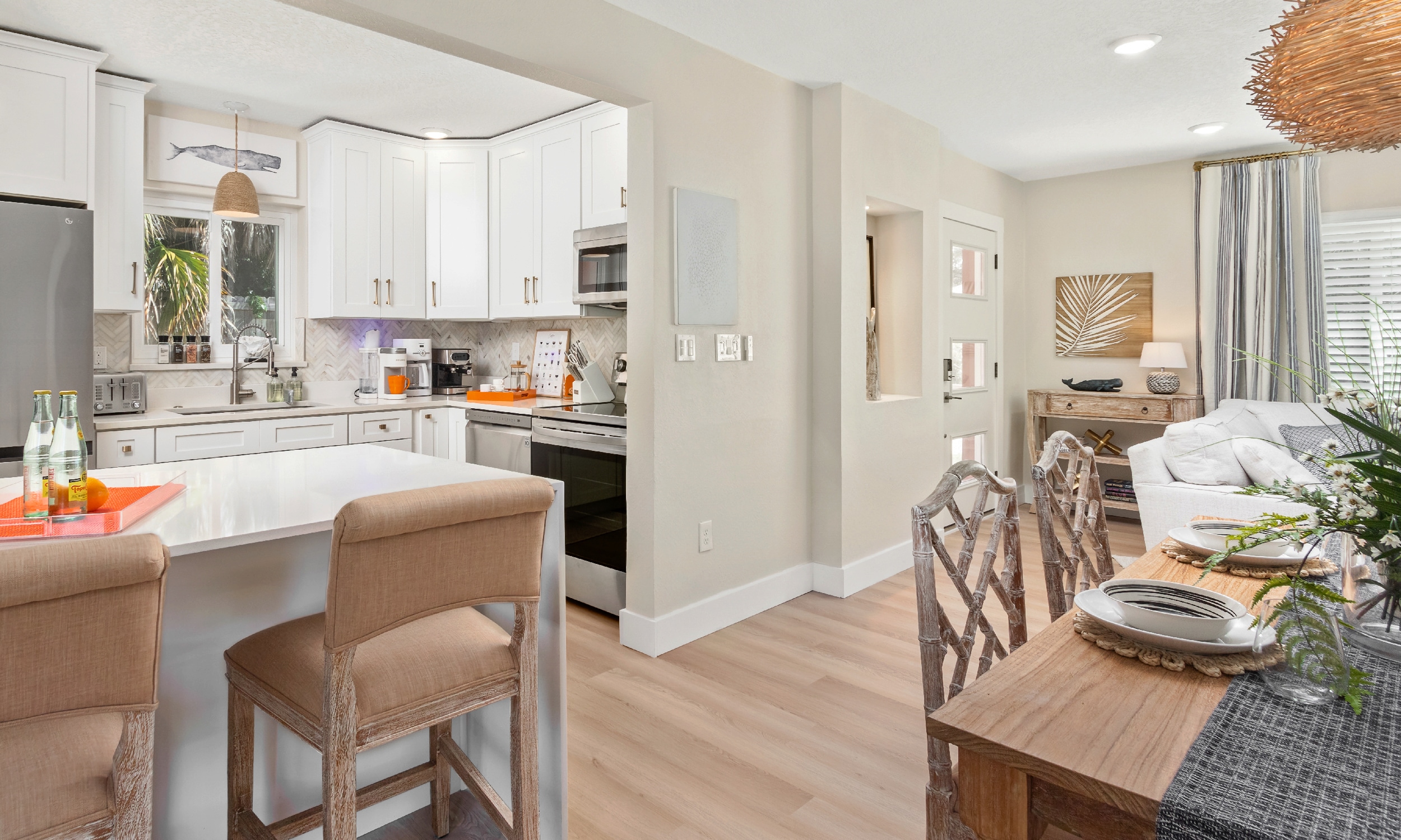 This dining area and kitchen are in a rental home that has an in-ground pool